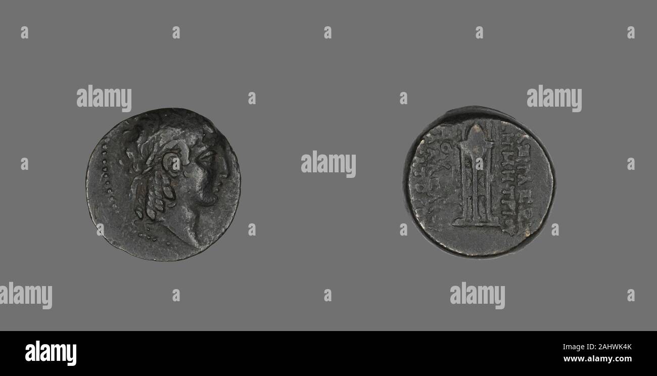 Ancient Greek. Coin Depicting the God Apollo. 146 BC–139 BC. Ancient Greece. Bronze Stock Photo