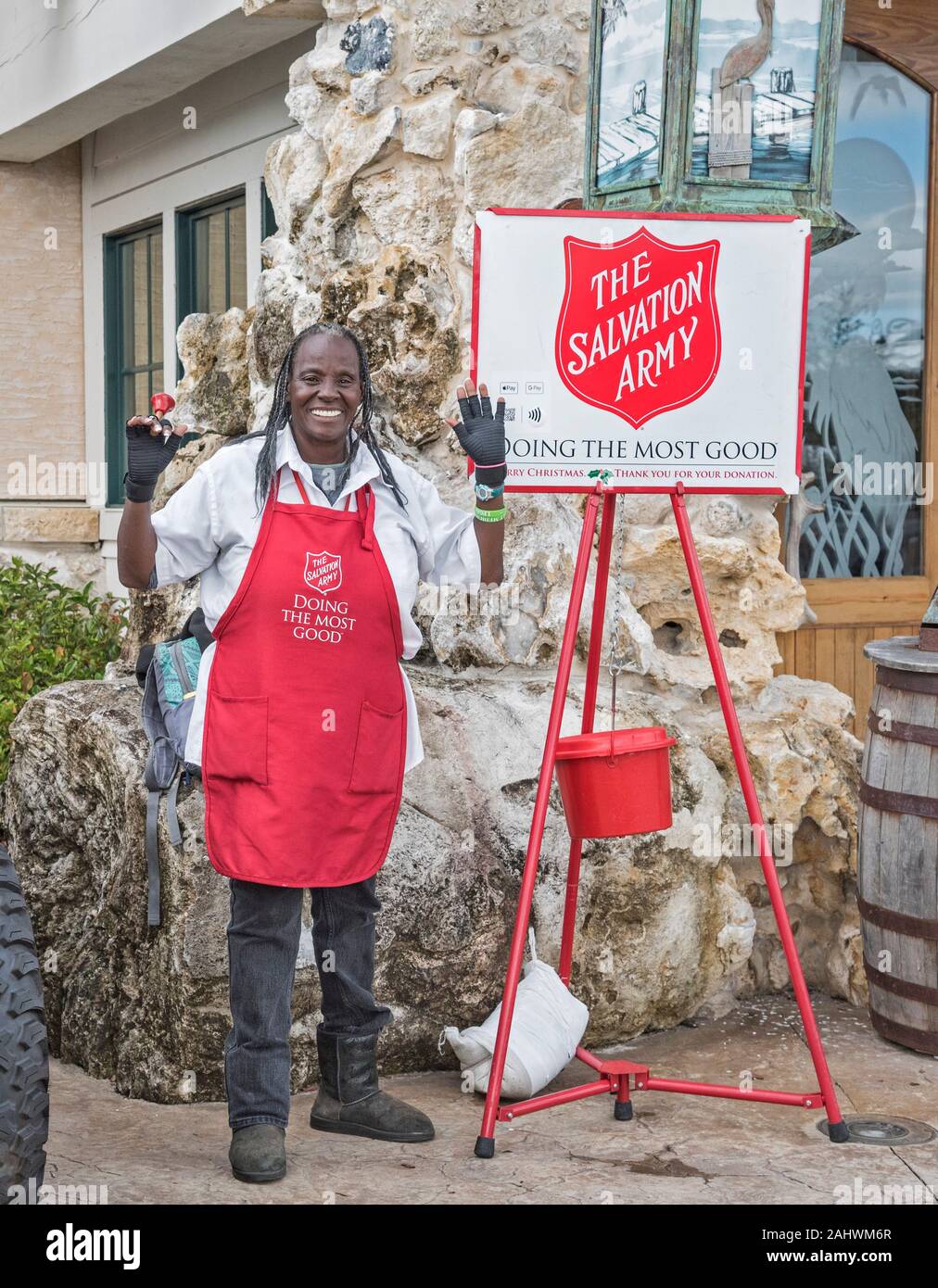 Salvation Army lady ringing the bell for donations at Christmas Time. Stock Photo