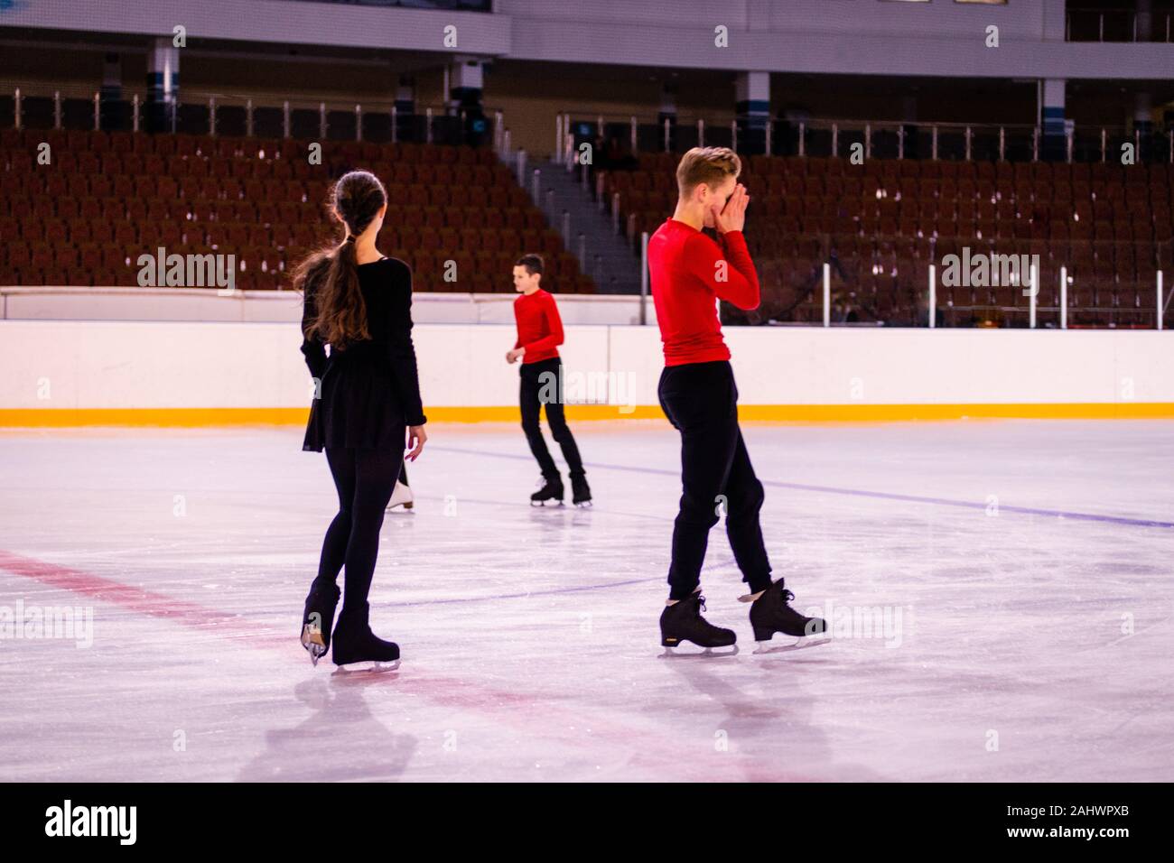 ice arena figure skating training. tired athletes after a difficult