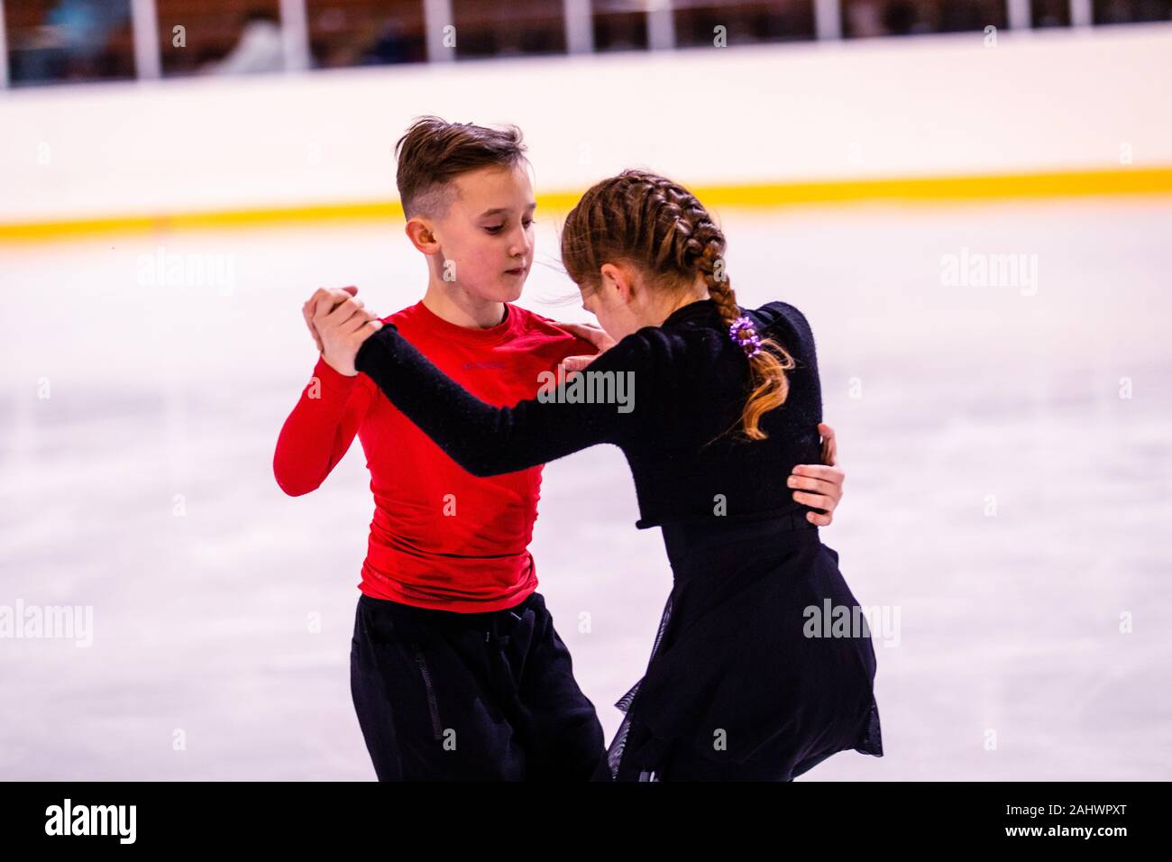 ice skating training. childrenathletes learn pair figure skating