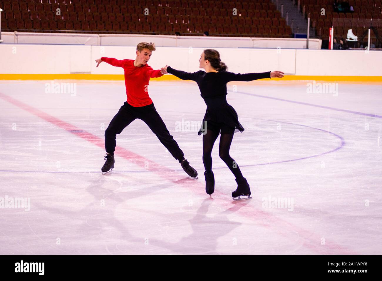 ice arena figure skating training. Partners perform dance moves Stock