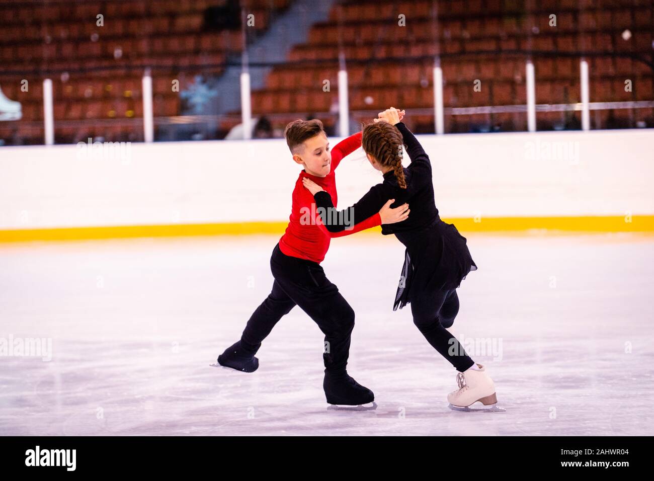 ice skating training. childrenathletes learn pair figure skating