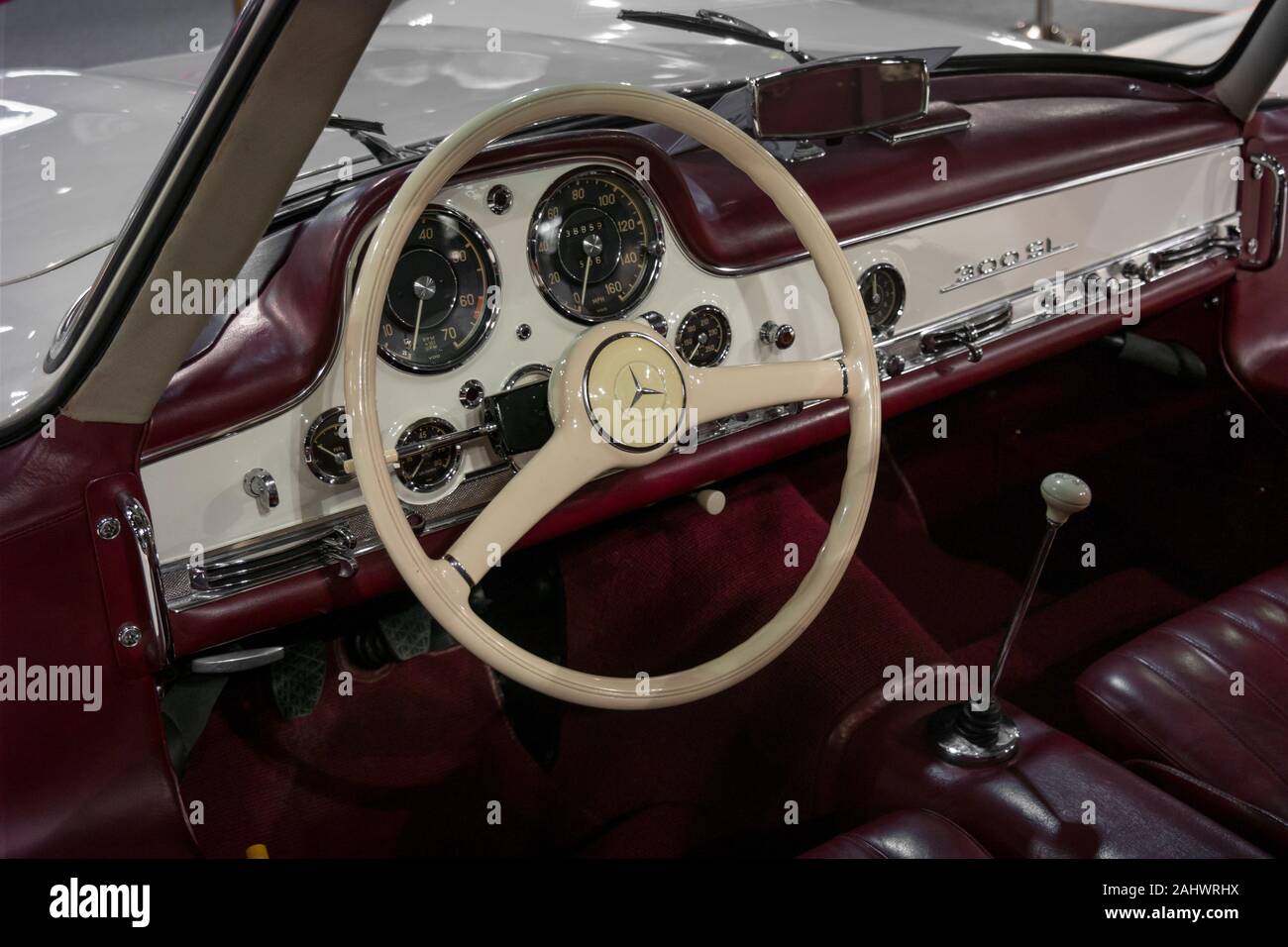 Interior design of a classic and vintage Mercedes Benz in maroon and white  Stock Photo - Alamy