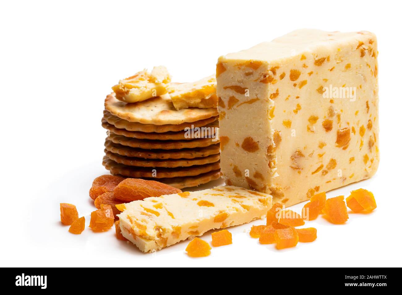 Traditional cheddar cheese with dry apricot isolated on white