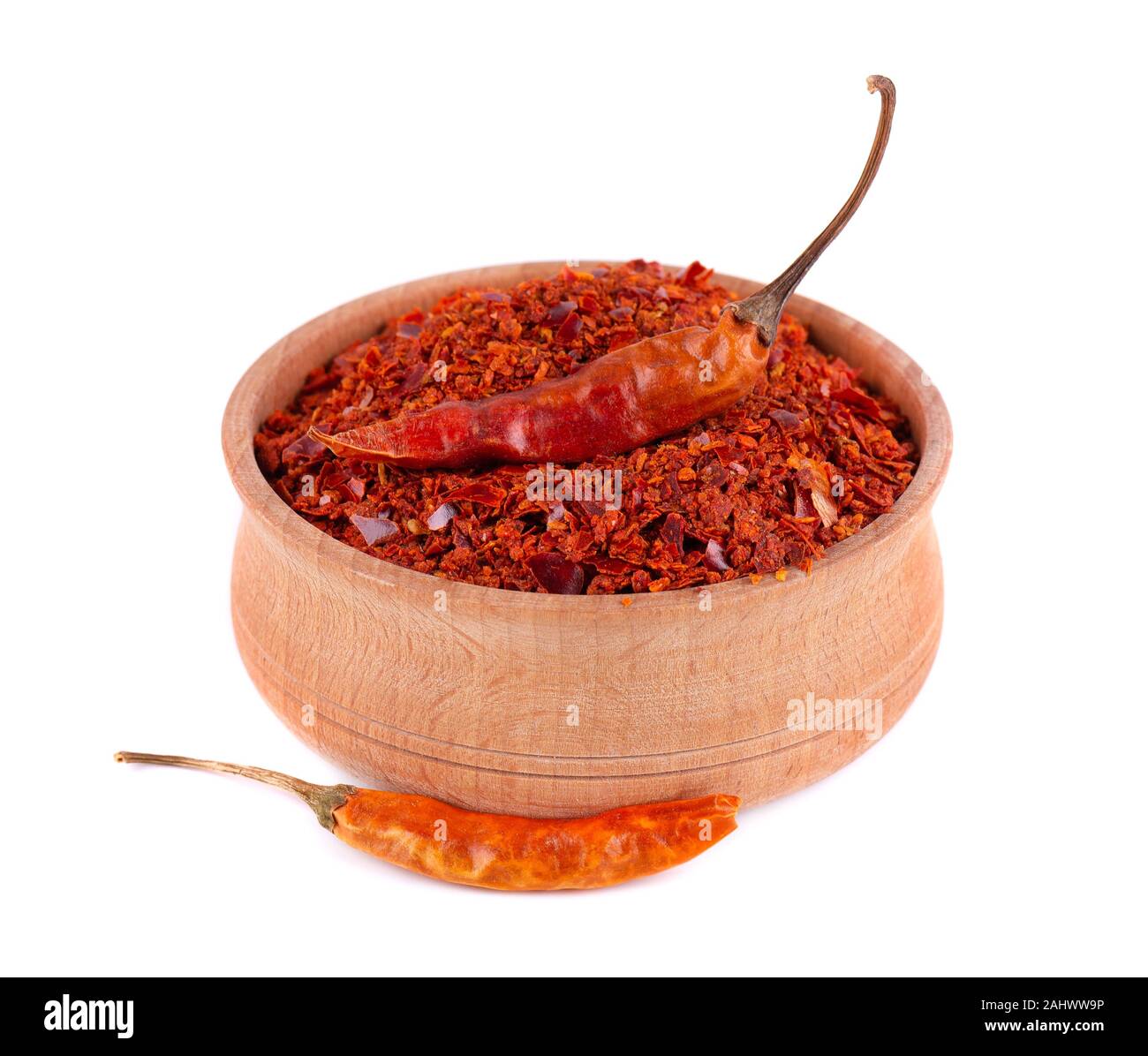 Dry and crushed chili pepper flakes isolated on white background. Red