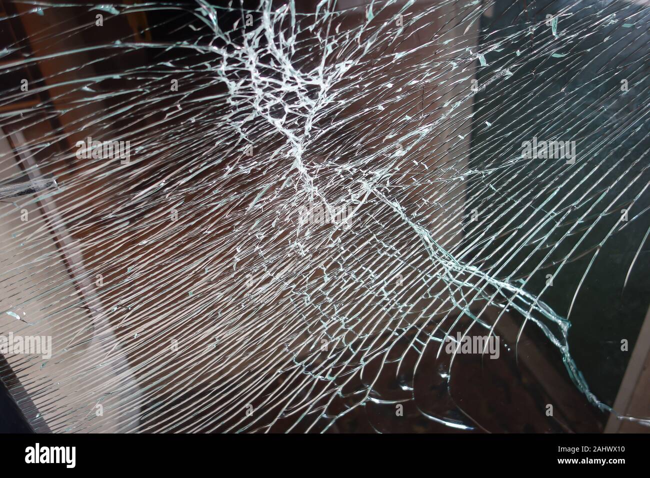 Broken glass front door windows of a main residential house. Made with