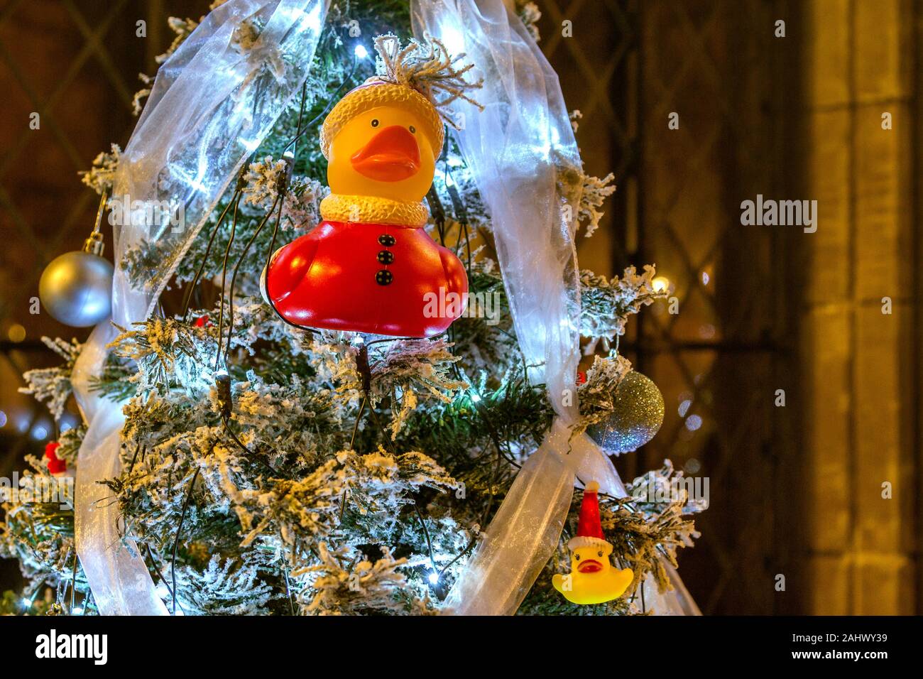 Rubber duck Santa. Non traditional Christmas tree decoration on a snow covered Christmas tree. Stock Photo