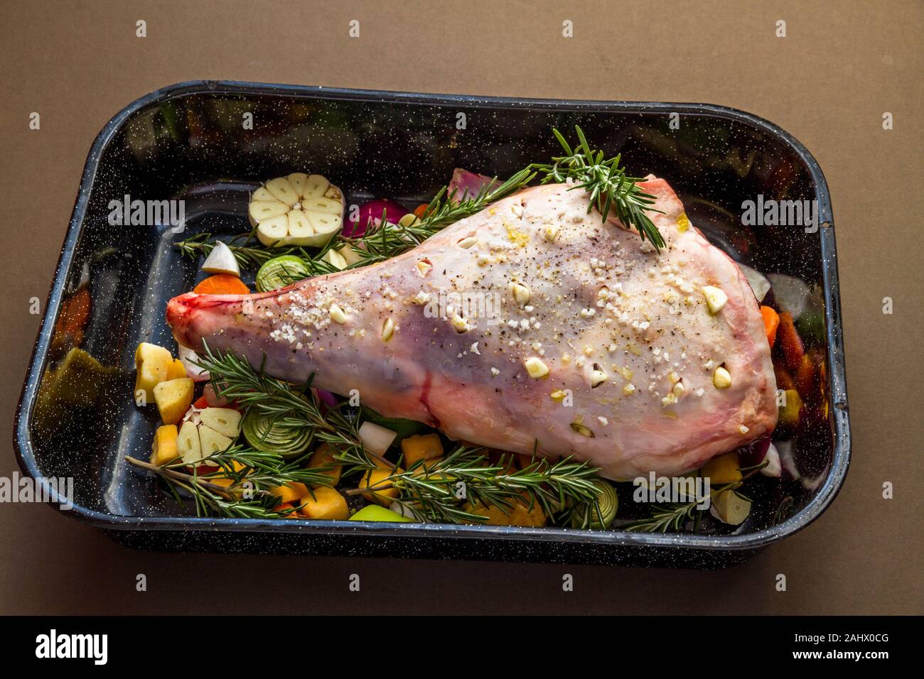 Leg Of Lamb Ready For Roasting In Tray With Salt, Garlic, Rosemary ...