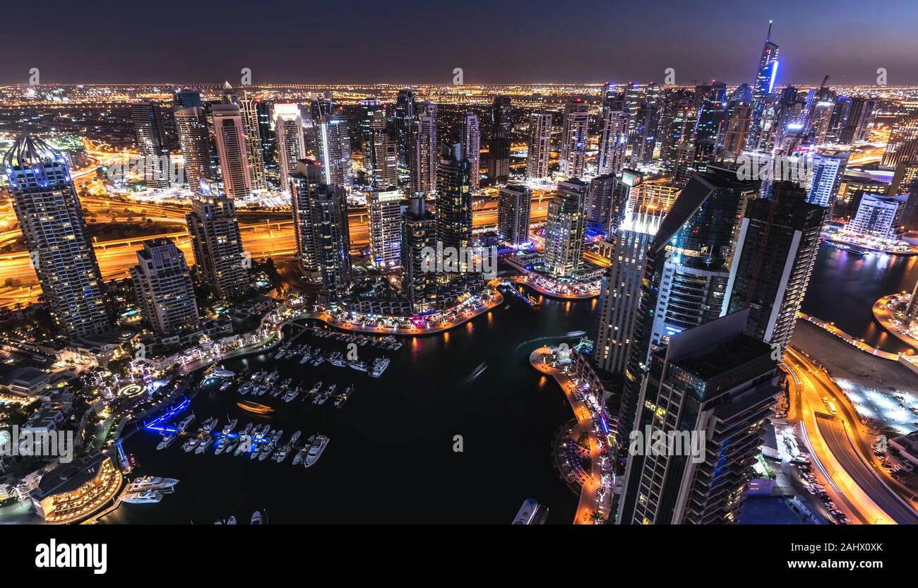Scenic nighttime skyline of Dubai, United Arab Emirates. Aerial view on Dubai cityscape Stock Photo