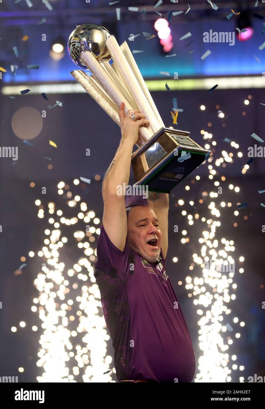 Peter Wright lifts the Sid Waddell Trophy after winning the William