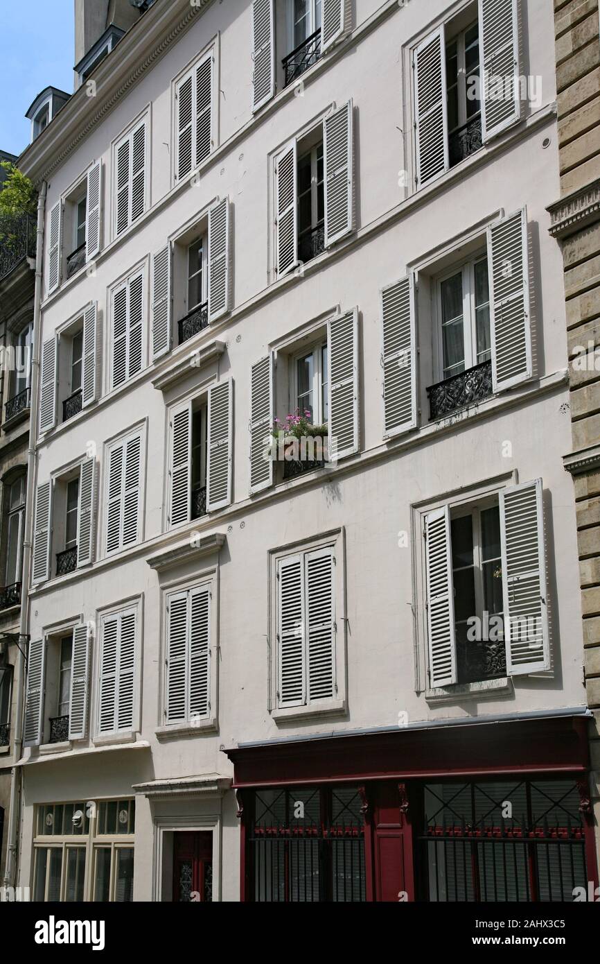 Paris, modern apartment building with louvered shutters on windows to keep out the sun Stock Photo