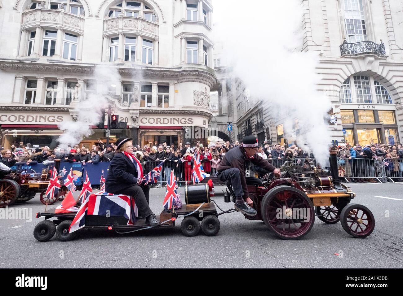 London, Britain. 1st Jan, 2020. People drive vintage cars during the annual New Year's Day Parade in London, Britain, Jan. 1, 2020. Credit: Ray Tang/Xinhua/Alamy Live News Stock Photo