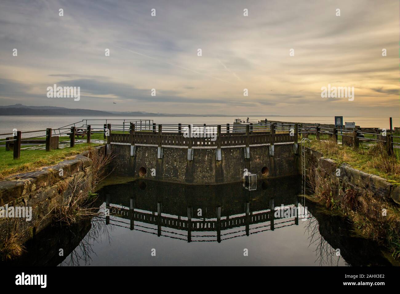 Sealed lock gates at the entrance to the disused Ulverston Canal from the Leven estruary at Canal Foot Stock Photo