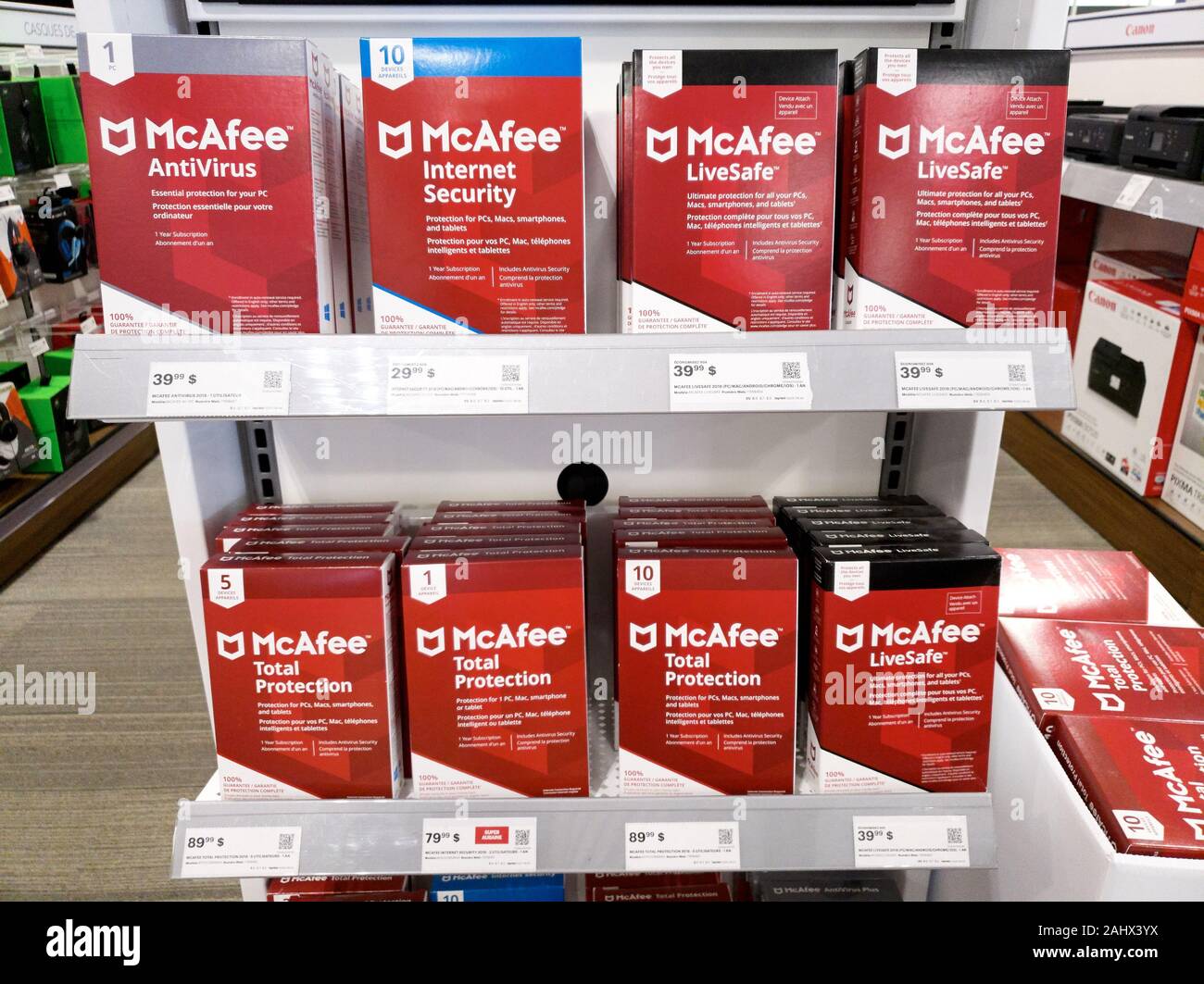 Montreal, Canada - December 26, 2019: McAfee products on shelves in store. McAfee is an American global computer security software company headquarter Stock Photo