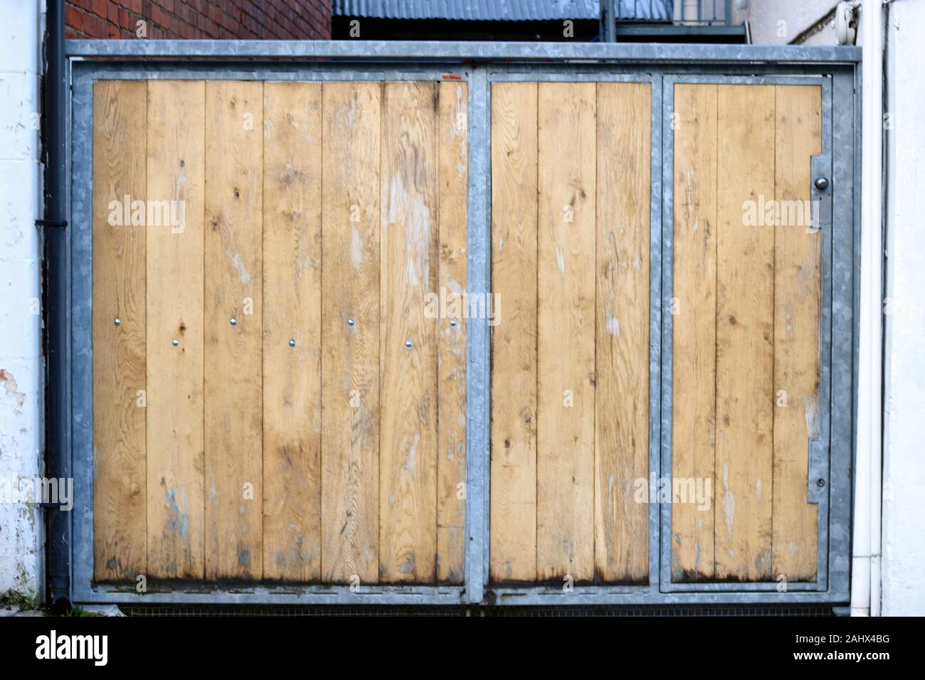 Gate with metal frame and wooden panels Stock Photo