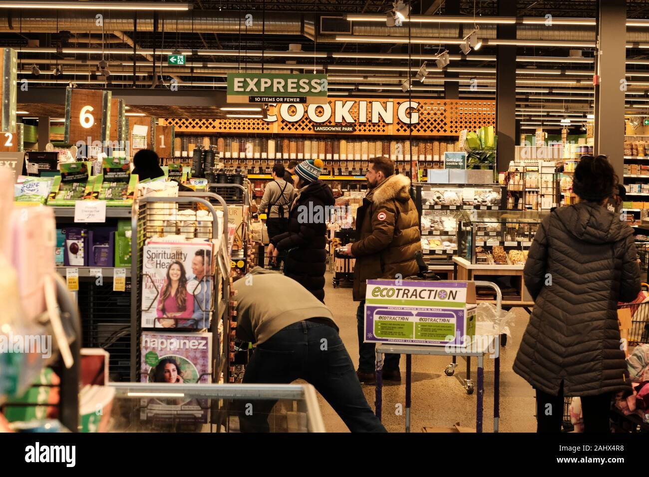 Looking down the checkout line at the queues and magazine stands at the