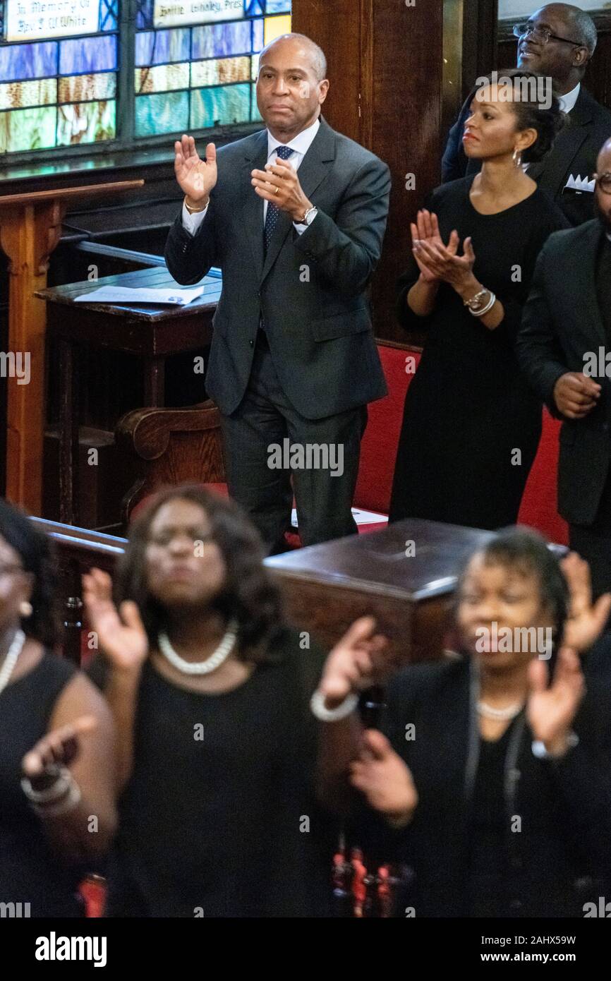 Charleston, United States. 01 January, 2020. Democratic presidential hopeful Gov. Deval Patrick of Massachusetts, left, and LaJoia Broughton, right, join in the worship service at the historic Mother Emanuel AME Church January 1, 2020 in Charleston, South Carolina. The service celebrated Emancipation Day, marking the abolition of slavery in the United States.  Credit: Richard Ellis/Alamy Live News Stock Photo