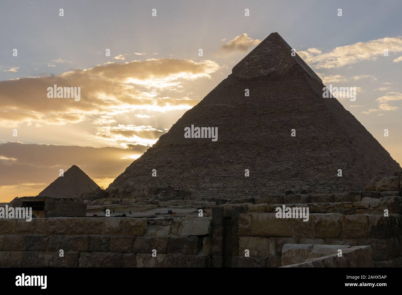 The Sun is going down behind the Pyramid of Menkaure Stock Photo