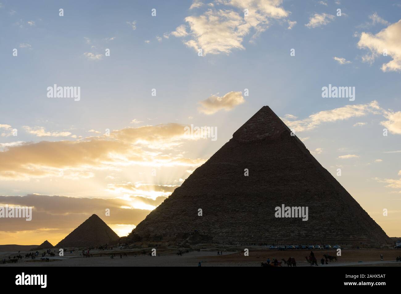 The Sun is going down behind the Pyramid of Menkaure Stock Photo