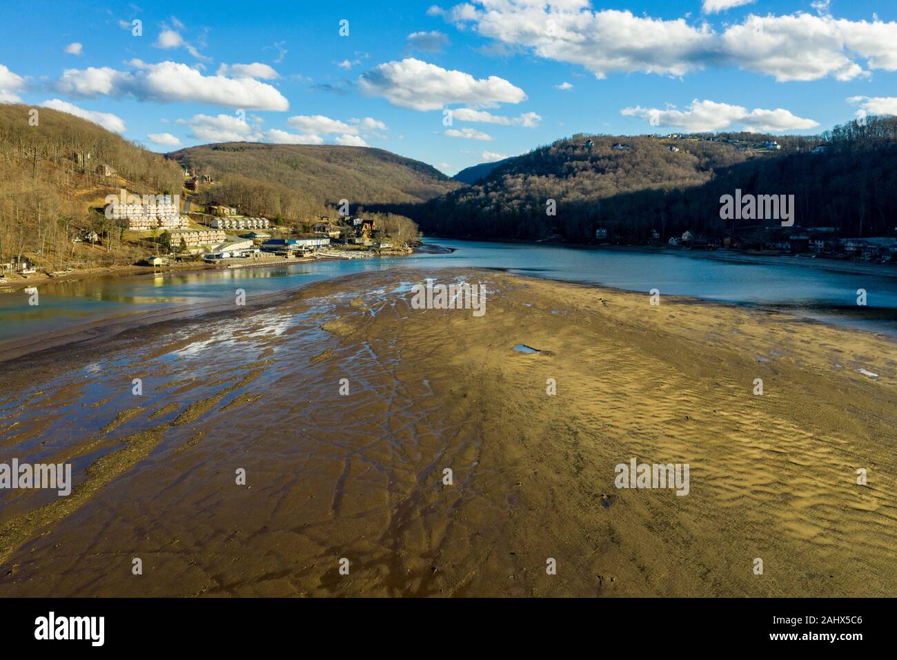 Very low water level in Cheat lake near Morgantown showing a large sand bank where the lake used to be Stock Photo
