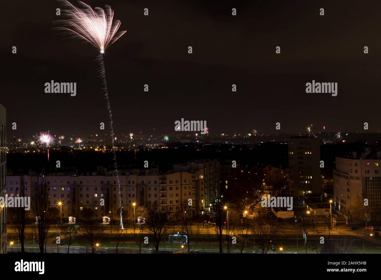 December 31, 2019. Krakow, Poland. Night city with shining lights, new year fireworks Stock Photo