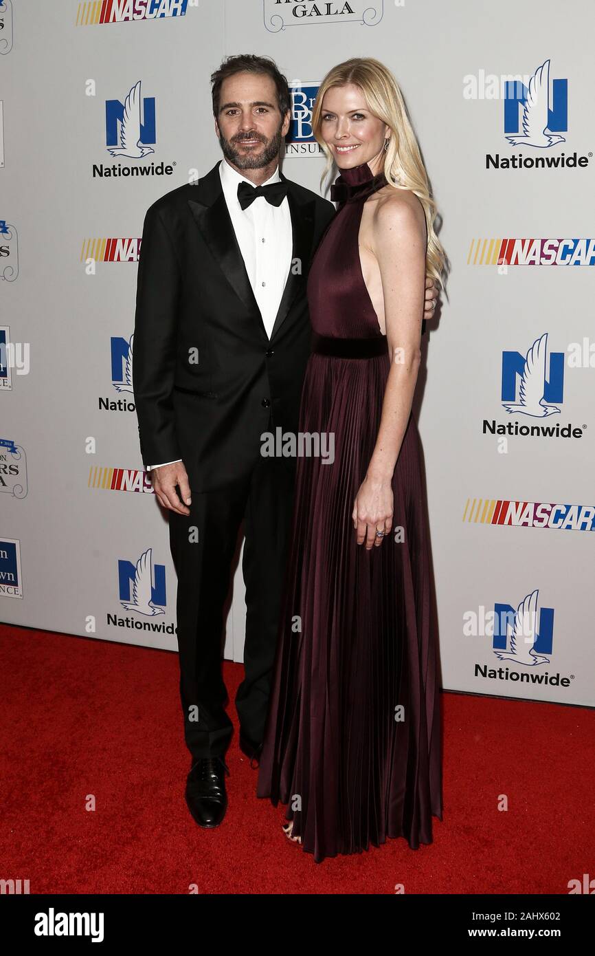 NEW YORK - SEPT 27: Jimmie Johnson (L) and wife Chandra Janway attend the 2016 NASCAR Foundation Honors Gala at Marriott Marquis on September 27, 2016. Stock Photo