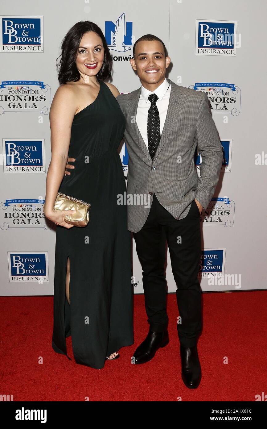 NEW YORK-SEPT 27: Actor Eddie Ramos (R) and guest attend the 2016 NASCAR Foundation Honors Gala at Marriott Marquis on September 27, 2016 in New York. Stock Photo