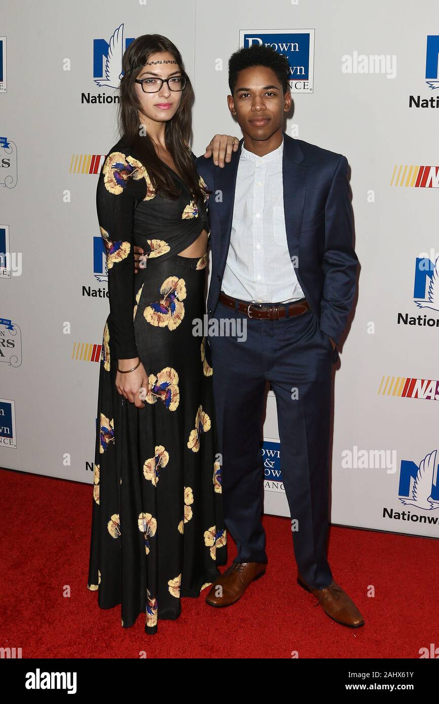 NEW YORK - SEPT 27: Actor Kelvin Harrison Jr (R) and guest attend the 2016 NASCAR Foundation Honors Gala at Marriott Marquis on September 27, 2016. Stock Photo