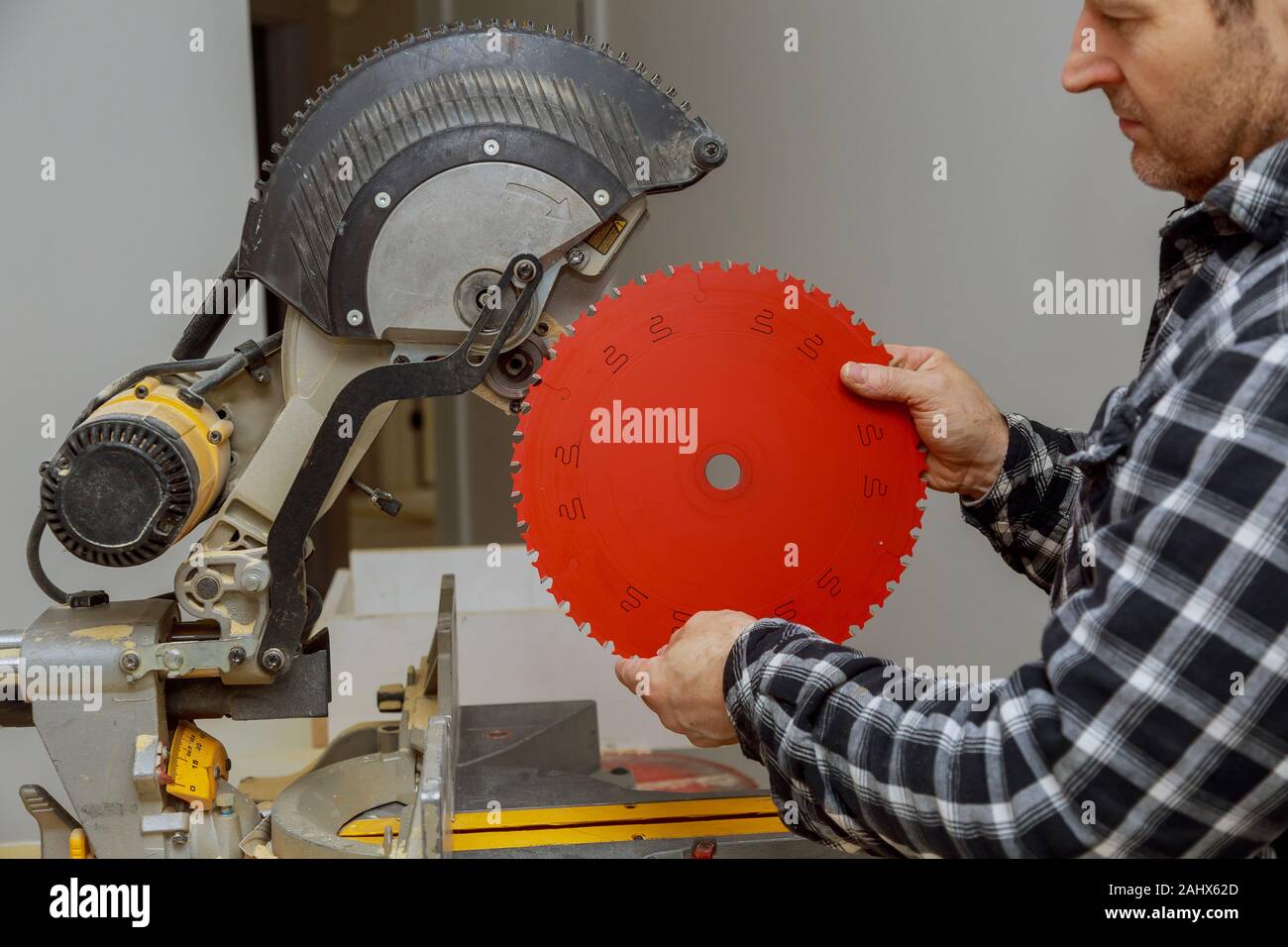 Carpenter replacing a rotary cutters blade in the circular saw Stock ...