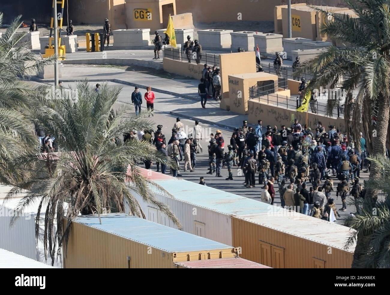 https://c8.alamy.com/comp/2AHX6EX/baghdad-iraq-01st-jan-2020-assailants-and-attackers-storm-the-entry-control-point-at-the-us-embassy-in-baghdad-iraq-on-january-1-2020-dozens-of-angry-iraqi-shiite-militia-supporters-broke-into-the-us-embassy-compound-in-baghdad-on-tuesday-december-31-2019-after-smashing-a-main-door-and-setting-fire-to-a-reception-area-photo-by-maj-charlie-dietzus-armyupi-credit-upialamy-live-news-2AHX6EX.jpg