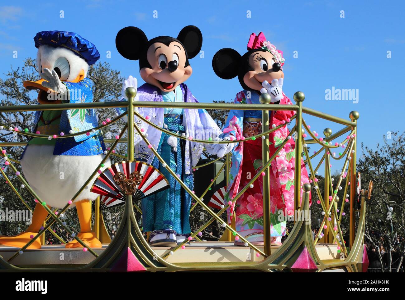 Urayasu, Japan. 1st Jan, 2020. Disney characters Mickey and Minnie Mouse in  traditional kimono dresses greet guests from a float during a New Year's  Day parade at the Tokyo Disneyland in Urayasu,