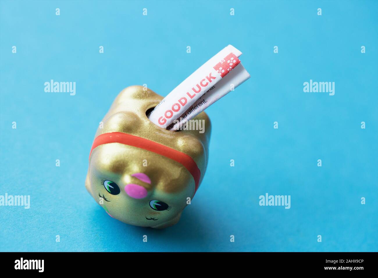 A Japanese pig figurine filled with a fortune and seeds to plant for good luck Stock Photo Alamy