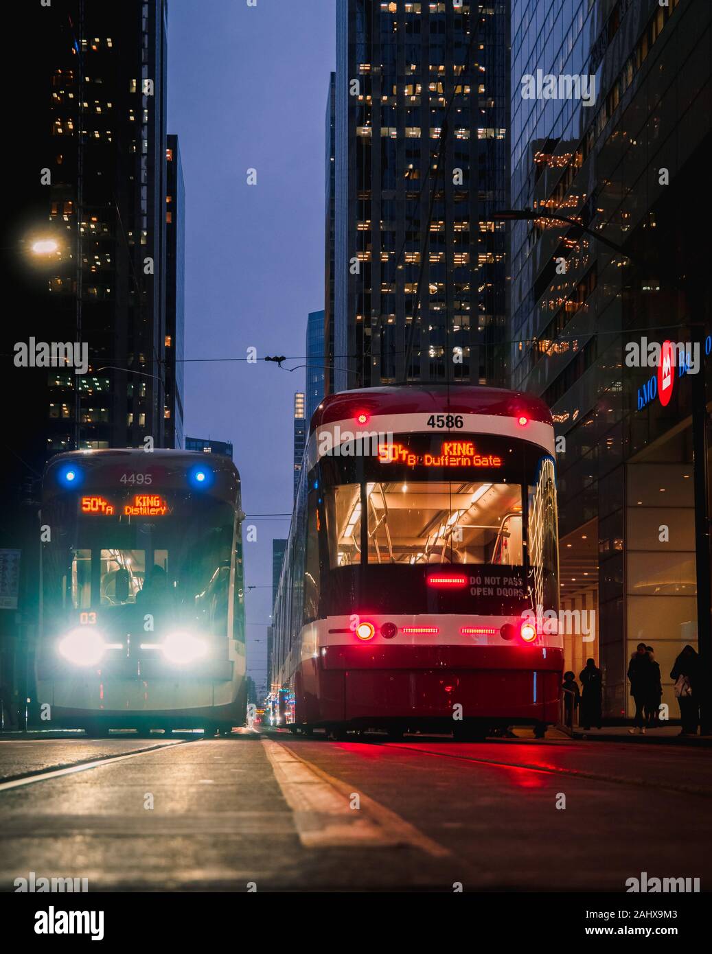 TTC Trams running on King Street, Toronto showing transportation during Dusk showing commuters returning home Stock Photo