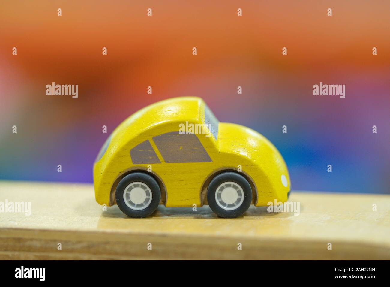 yellow car model on road, cars for kids Play set Educational toys for preschool indoor playground (selective focused) Stock Photo
