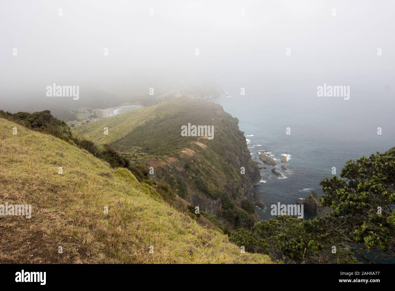 A cloud covered view of the Te Paki Coastal Track, Northland, New Zealand, and Tapotupotu Bay beyond Stock Photo