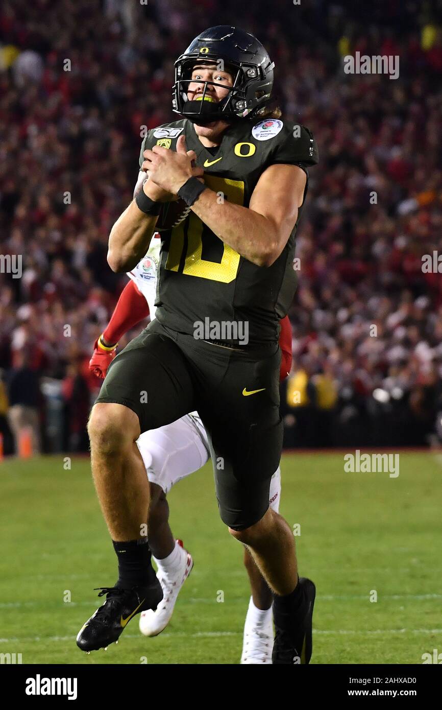 Justin Herbert Oregon Ducks Unsigned All White Throwing Photograph