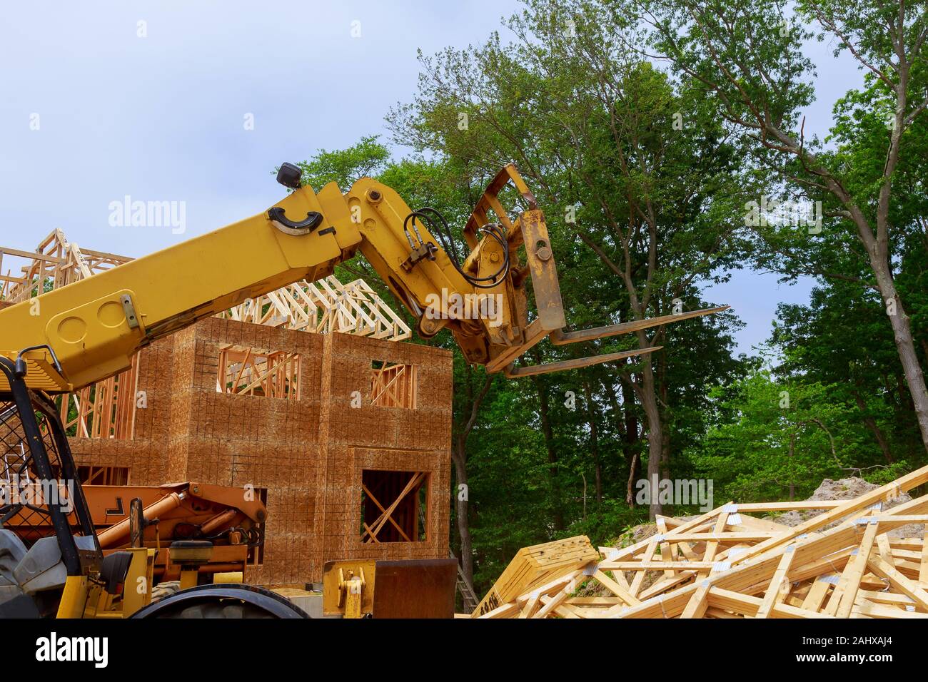 Boom truck forklift in the New framing construction home Stock Photo Alamy