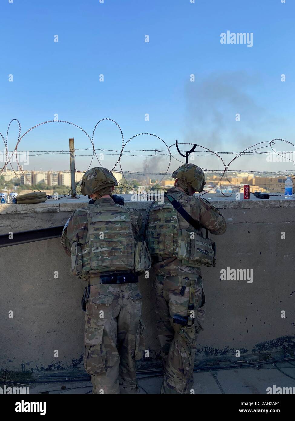 Baghdad, Iraq. 31 December, 2019. U.S. Army Soldiers from 1st Brigade, 25th Infantry Division, Task Force-Iraq, man an observation post at Forward Operating Base Union III overlooking the U.S. Embassy Compound following violent protests by Iran backed militias January 1, 2020 in Baghdad, Iraq. Credit: Maj. Charlie Dietz/Planetpix/Alamy Live News Stock Photo