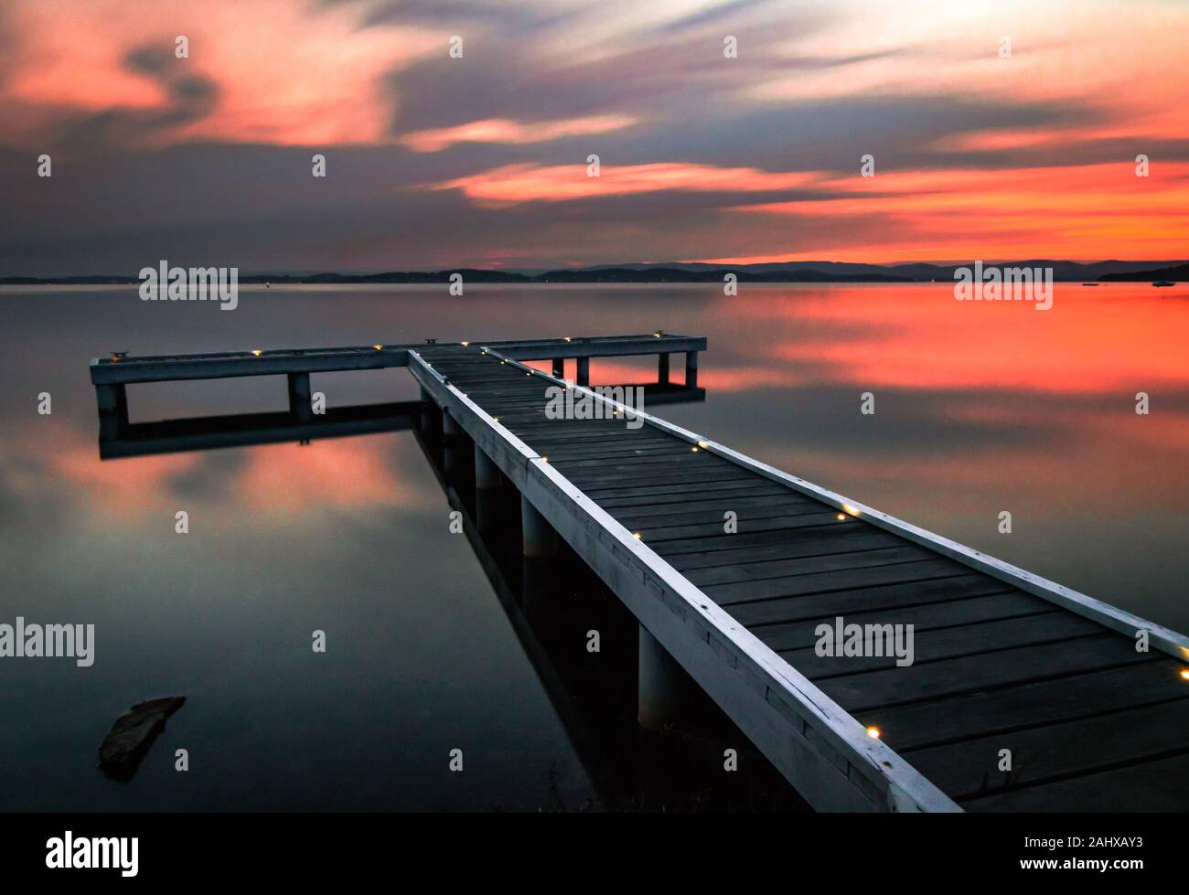 squid ink jetty of lake macquarie in sunset Stock Photo