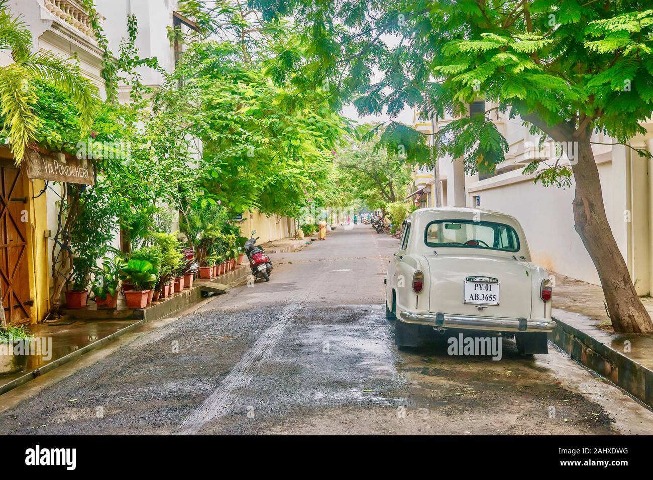Puducherry, India - December 9, 2013. A beige vintage Ambassador car is parked on a street in the White Town area of the former French colonial town. Stock Photo