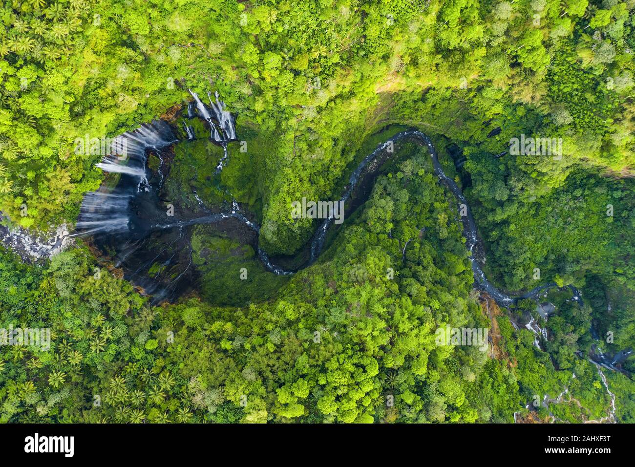 View from above, stunning aerial view of the Tumpak Sewu Waterfalls also known as Coban Sewu. Stock Photo