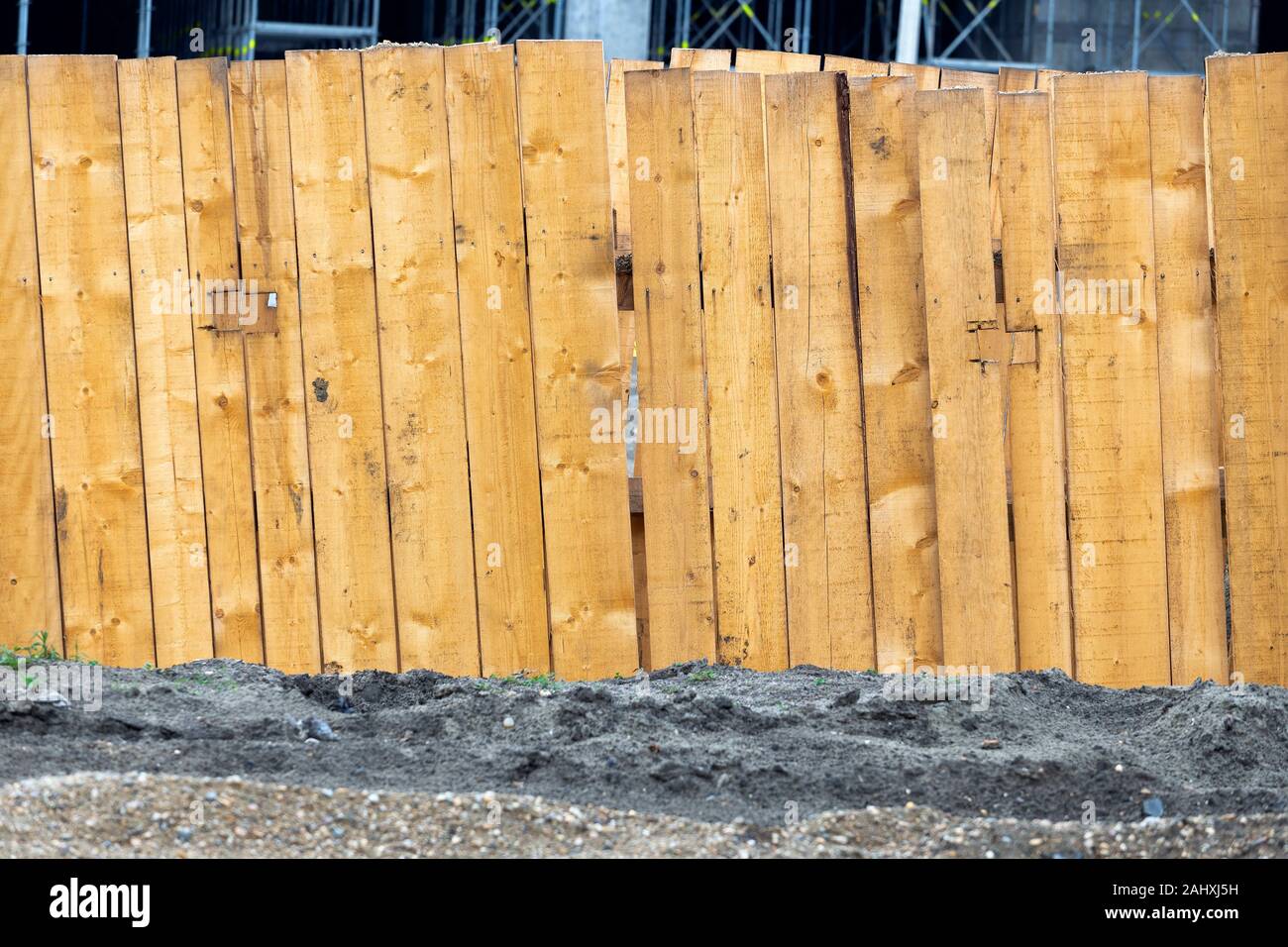 Wooden boards supports to protect the walls of the trench from collapsing. Trench walls are