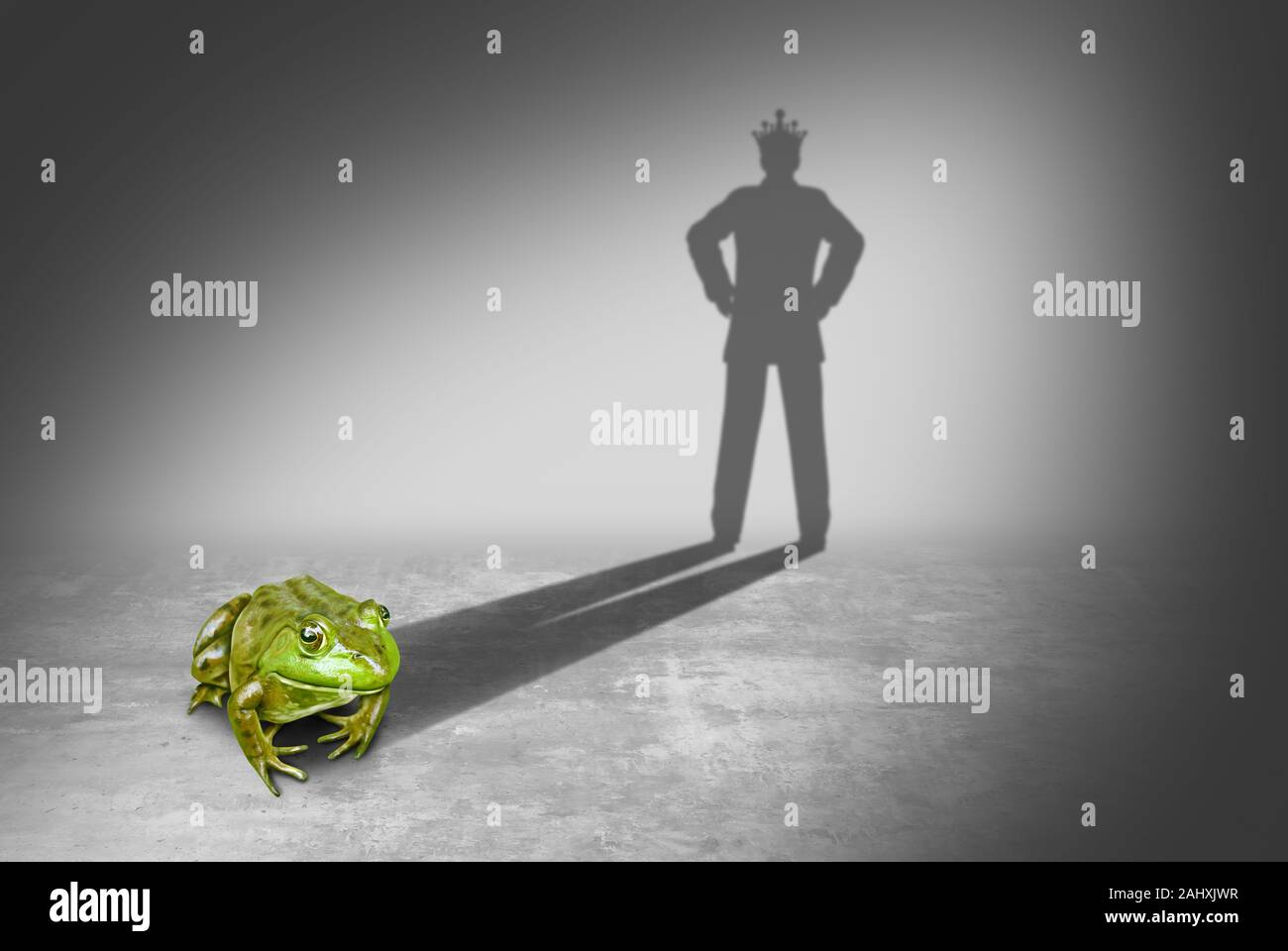 Frog prince casting a shadow of a royal prince charming wearing a gold crown representing the fairy tale concept of change and transformation. Stock Photo