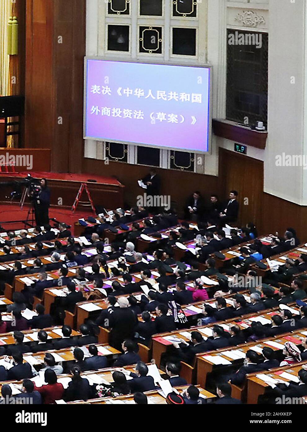 Beijing, China. 15th Mar, 2019. The second session of the 13th National People's Congress (NPC) holds its closing meeting at the Great Hall of the People in Beijing, capital of China, March 15, 2019. China's national legislature passed the foreign investment law at the meeting. Credit: Liu Bin/Xinhua/Alamy Live News Stock Photo