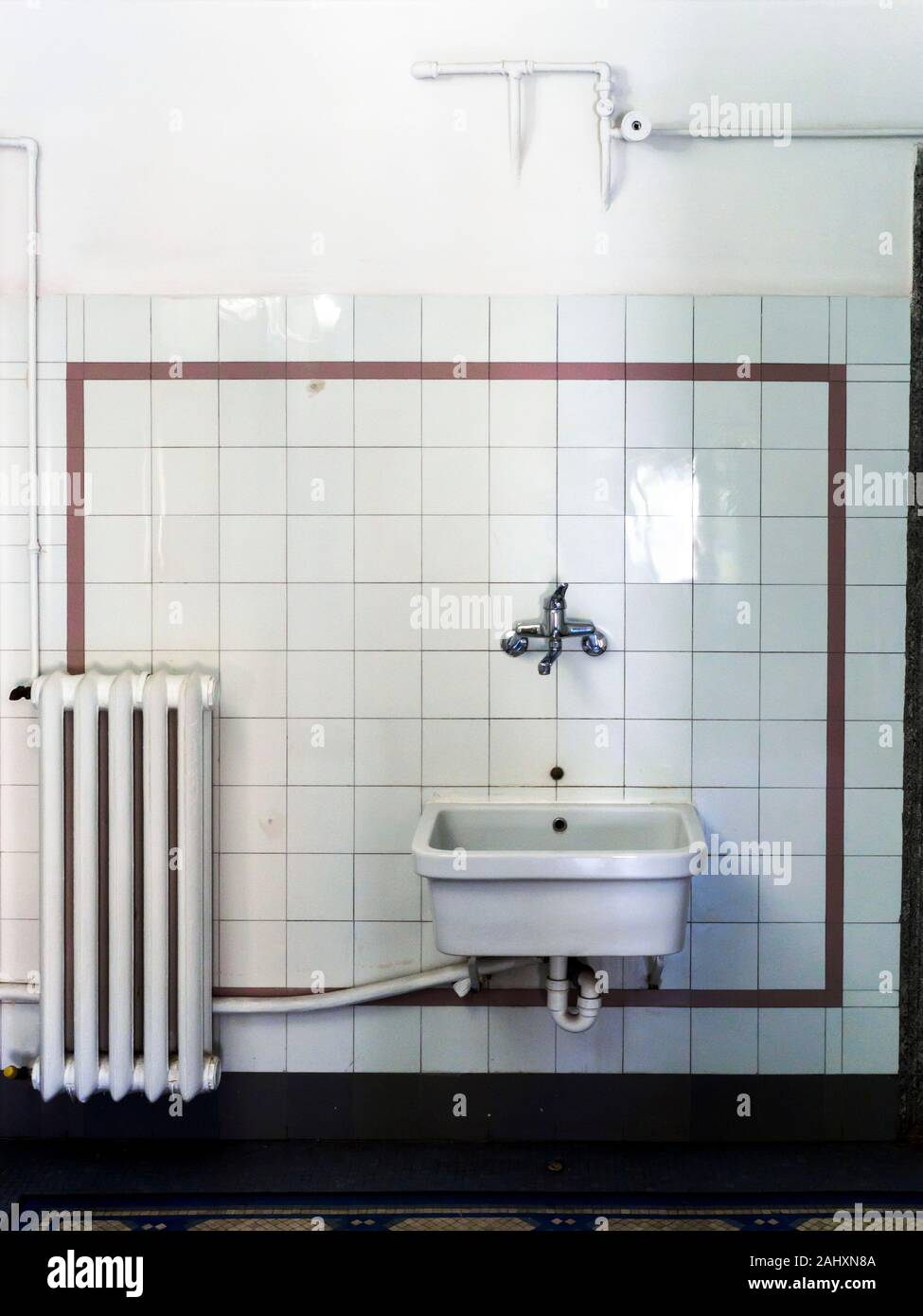 Sink and radiator in the toilet  of Villa Farnesina - Rome, Italy Stock Photo