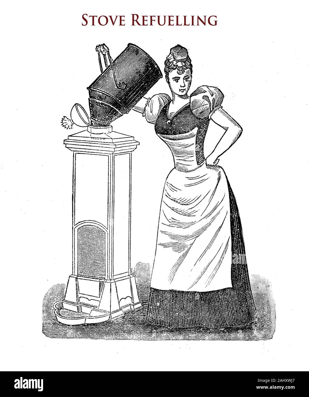 Maid refuelling an iron heating stove with coal coke Stock Photo