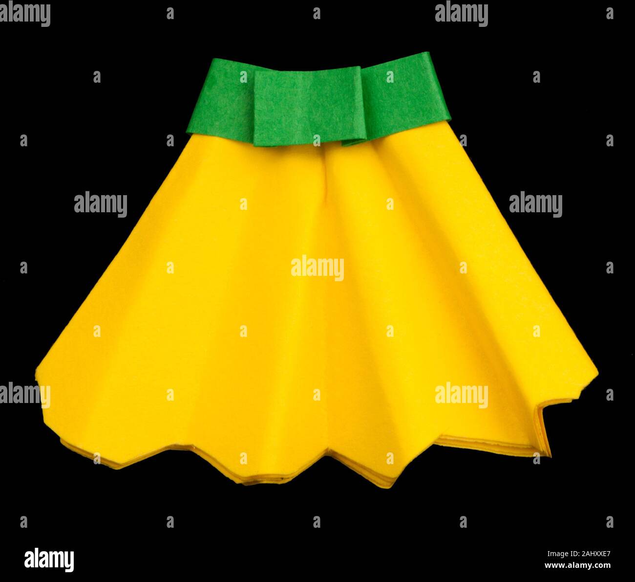 Yellow skirt folded origami style Stock Photo Alamy