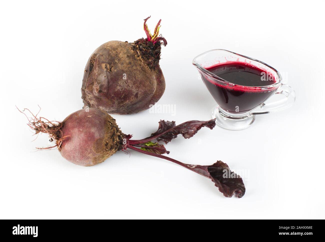 Red beets with leaves and jug with juice white isolated Stock Photo Alamy