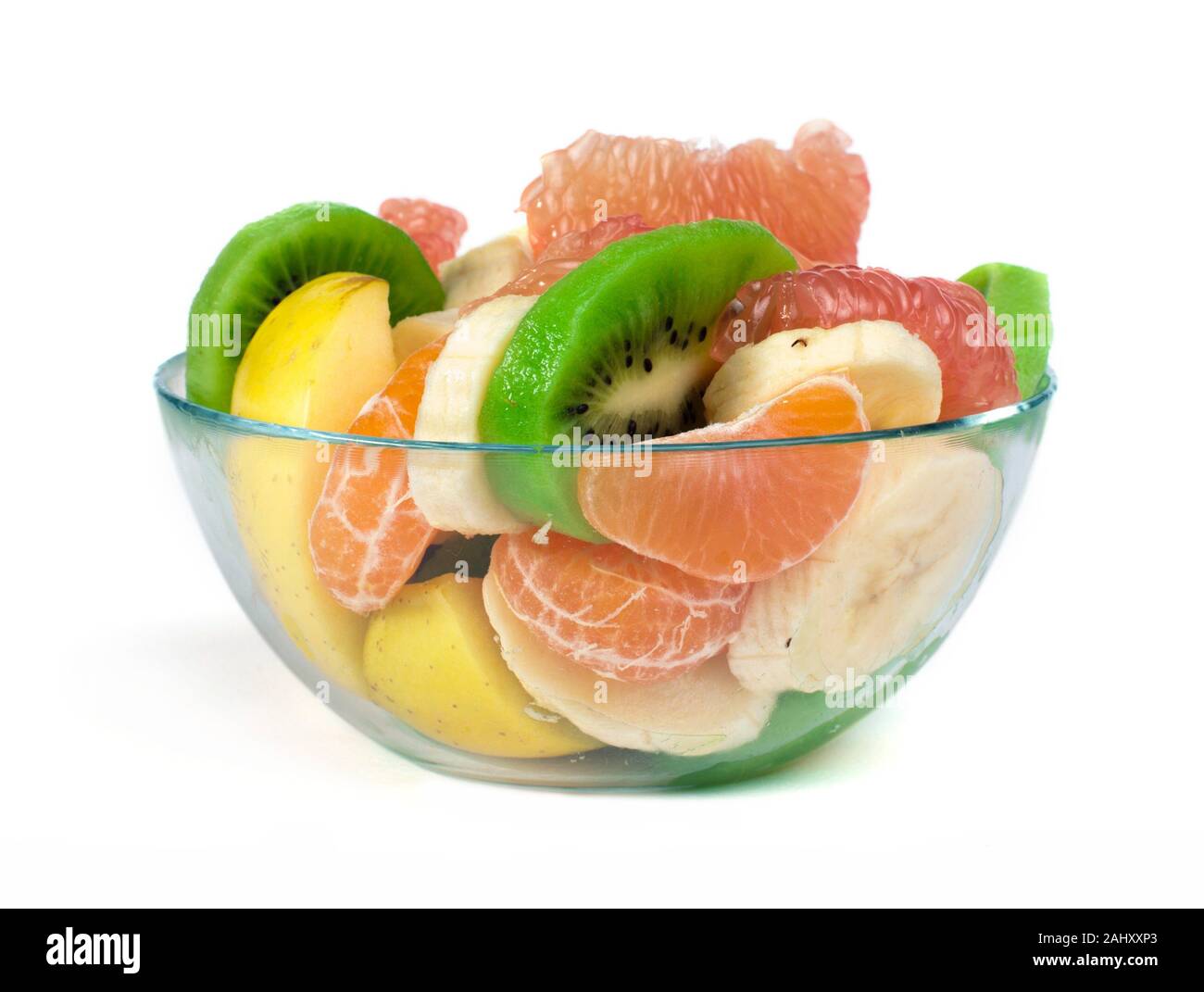Fruit salad with citrus in a glass bowl on a white background Stock ...