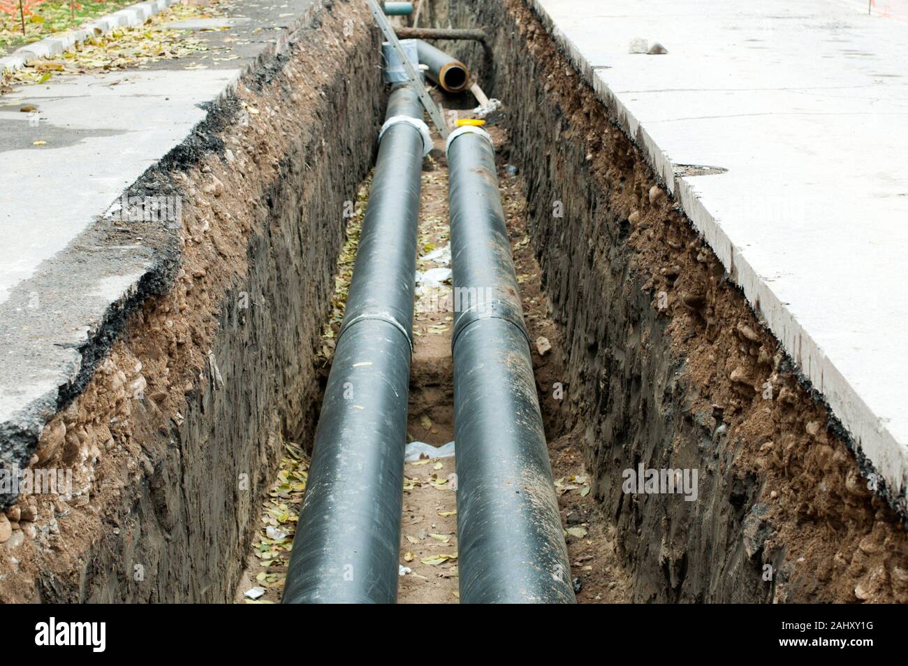Installing pipes for hot water and steam heating. City heat pipeline
